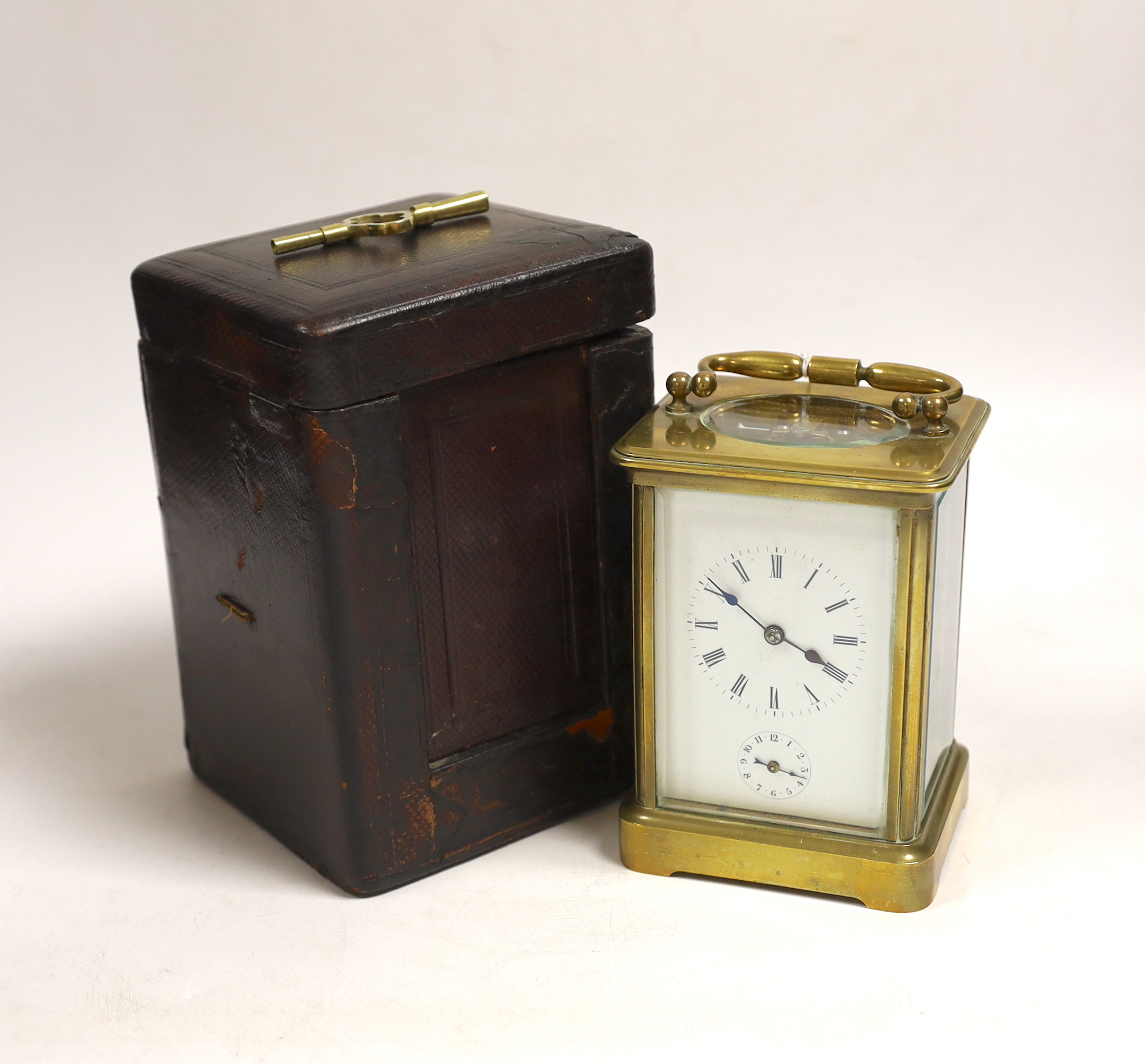 A late 19th century French carriage clock, with alarm, portable in case, clock 14cm high